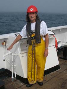 Amy Pearson with a harnass connecting with ship for buoy deployment. 