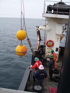 Deck crew of the OSCAR DYSON retrieving sensors from a buoy. 