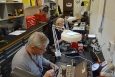 WEMS technicians Jim Snodgrass (left) and Jim Dixon set pins in security lock cores at the X-720 Lock shop.