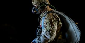 A U.S. Air Force master sergeant prepares for a high altitude low opening parachute jump aboard a C-130J Hercules, Nov.16, 2016. The aircraft is capable of operating from rough, dirt strips and is the prime transport for airdropping troops and equipment into hostile areas. (U.S. Air Force photo/Staff Sgt. Kenny Holston)