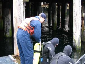 NOAA divers preparing to install a tide gauge at Noyes Island, AK 