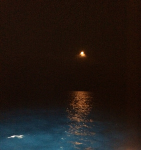 The Moon rises over the water at the beginning of my shift at midnight.