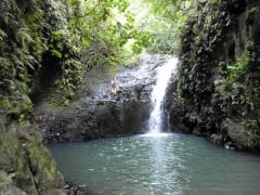 Jumping off the falls at Maunawili Falls 