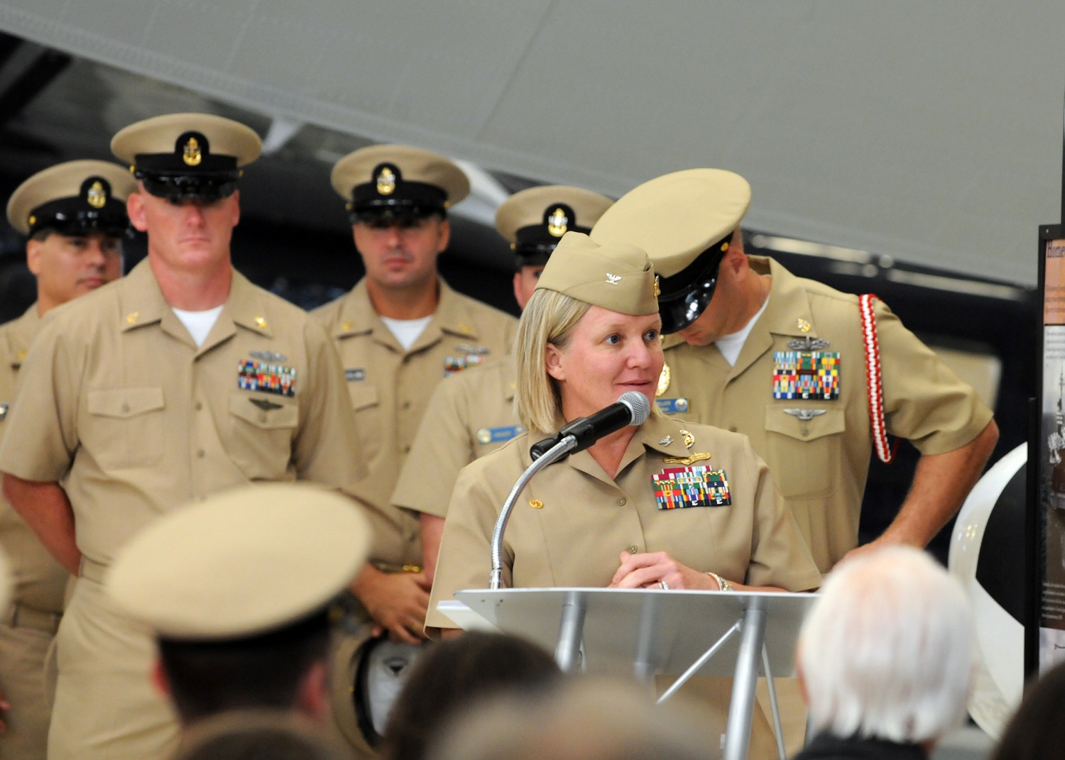 Capt. Maureen Fox, Center for Information Dominance commanding officer, speaks to chief selects at the Naval Air Station Corry Station chief's pinning ceremony at the National Naval Aviation Museum. U.S. Navy photo by Carla M. McCarthy