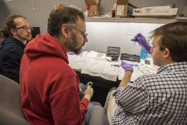 Photo - Lee Bernstein (center), works on the setup for a nuclear physics experiment at Berkeley Lab’s 88-Inch Cyclotron with UC Berkeley graduate students Andrew Voyles (right) and Alexander Springer (left). (Credit: Marilyn Chung/Berkeley Lab)