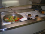 Each nght the steward, cook, prepares a salad bar in the galley.