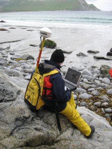 LT Mike Gonsalves takes a GPS location while sitting on one of the five benchmarks.