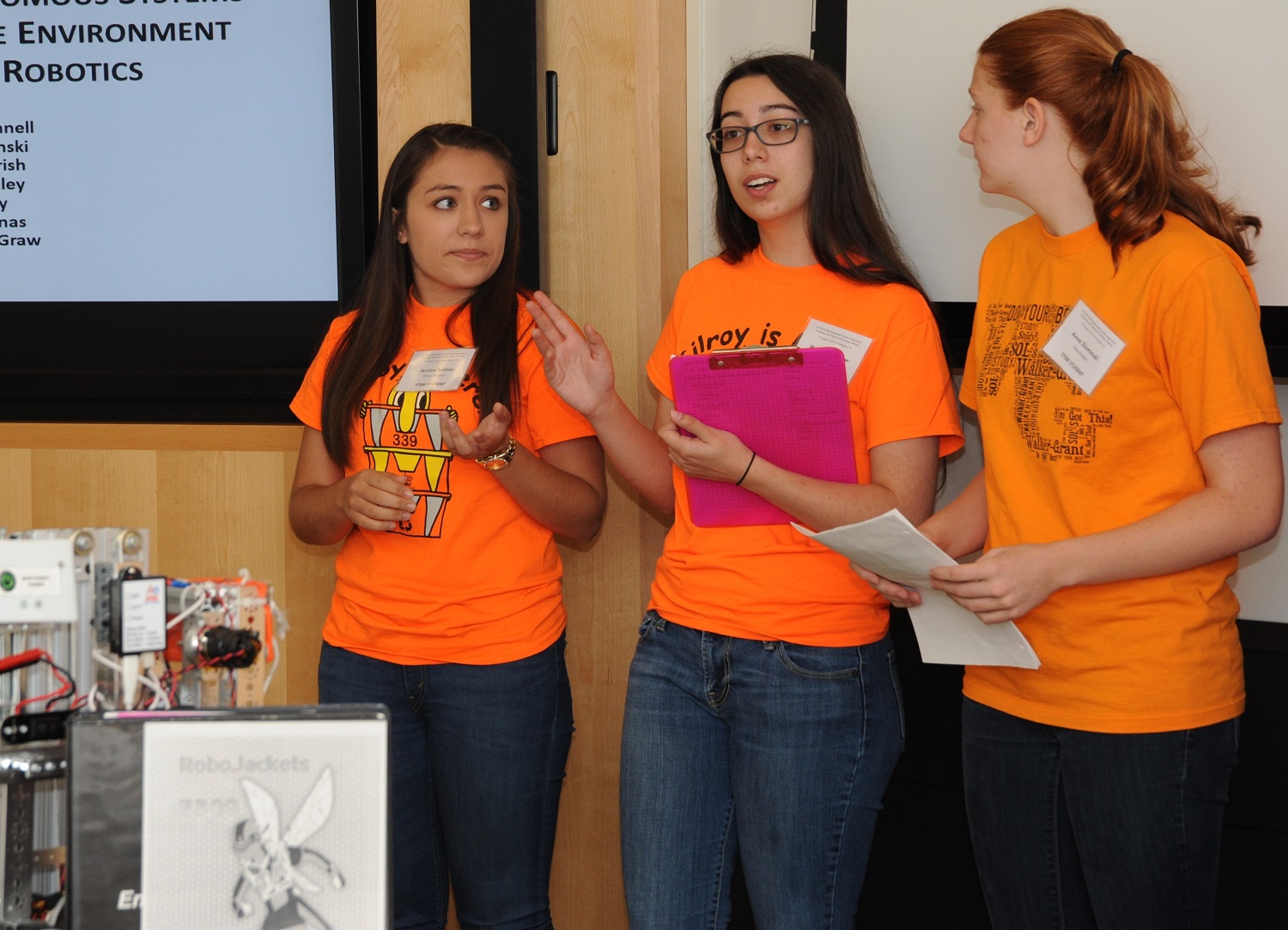 Jessica Salinas, Marlene McGraw, and Anna Slominski – high school students mentored by Naval Surface Warfare Center Dahlgren Division (NSWCDD) scientists and engineers - brief unmanned systems experts on "Integrating Autonomous Systems in the Pre-College Environment using FIRST Robotics" at the second annual NSWCDD Unmanned Systems Integration Workshop and Technical Exchange Meeting, Aug. 19. They were among students from two robotics teams who provided hands-on robotics demonstrations throughout the day.  FIRST (For Inspiration and Recognition of Science and Technology) is a non-profit organization with the mission to design accessible, innovative programs to build self-confidence, knowledge and life skills while motivating young people to pursue opportunities in science, technology and engineering. U.S. Navy photo by Tammy Indseth 