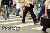 People walking across a busy crosswalk.