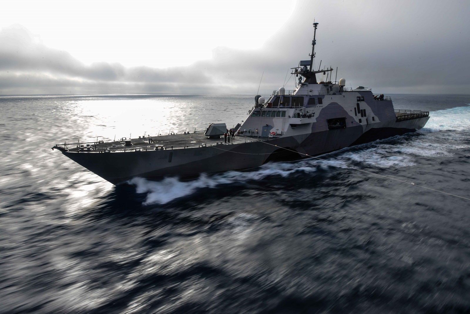 PACIFIC OCEAN (April 28, 2015) The littoral combat ship USS Freedom (LCS 1) transits alongside the aircraft carrier USS John C. Stennis (CVN 74) in preparation for a replenishment-at-sea training exercise. U.S. Navy ships are underway conducting an independent deployer certification exercise off the coast of Southern California. The exercise provides a multi-ship environment to train and certify independent deployers in surface warfare, air defense, maritime-interception operations, command and control/information warfare, command, control, computers and combat systems intelligence and mine warfare. U.S. Navy photo by Mass Communication Specialist 3rd Class Ignacio D. Perez.