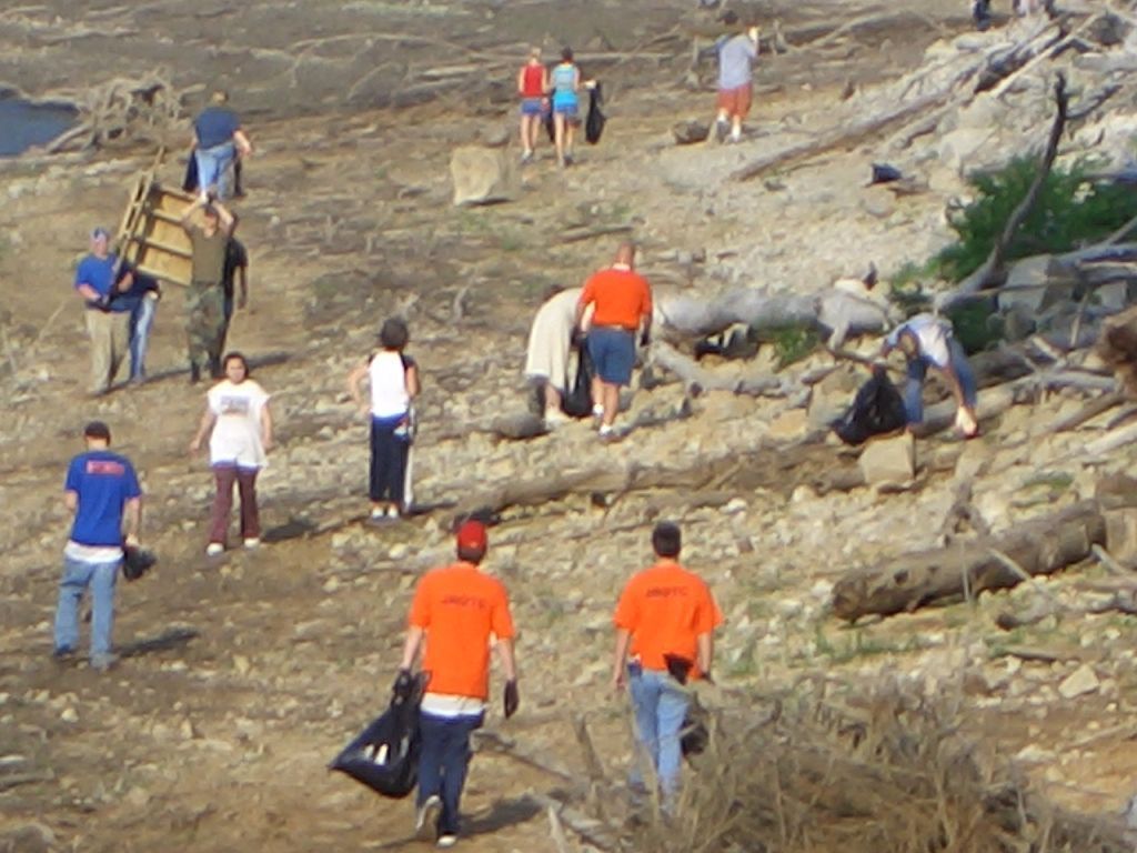 Volunteers picking up trash along the shoreline during Lake Cumberland's Shoreline Cleanup