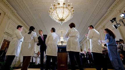 President Obama shakes hands with doctors at an event in the White House