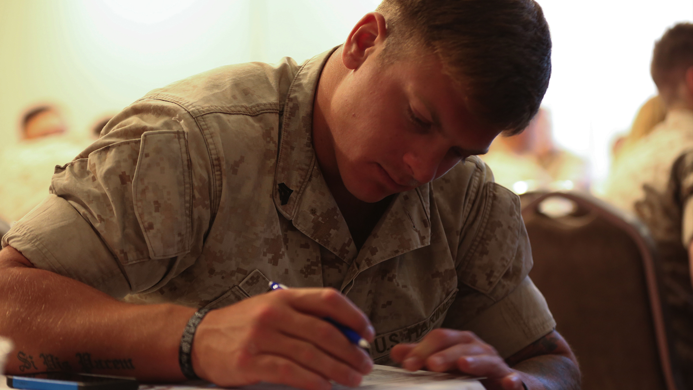 Cpl. Travis Langan, role player, Tactical Training Exercise Control Group, fills out résumé information during the ‘Hiring our Heroes’ employment and education workshop.