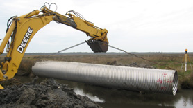 Heavy equipment places a new culvert