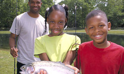 Children with fish. Photo by Carl Zitsman / U.S. Fish and Wildlife Service