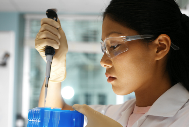 Researcher with pipette