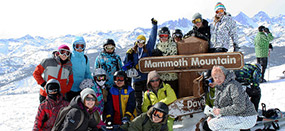 Photo of skiers on top of mountain