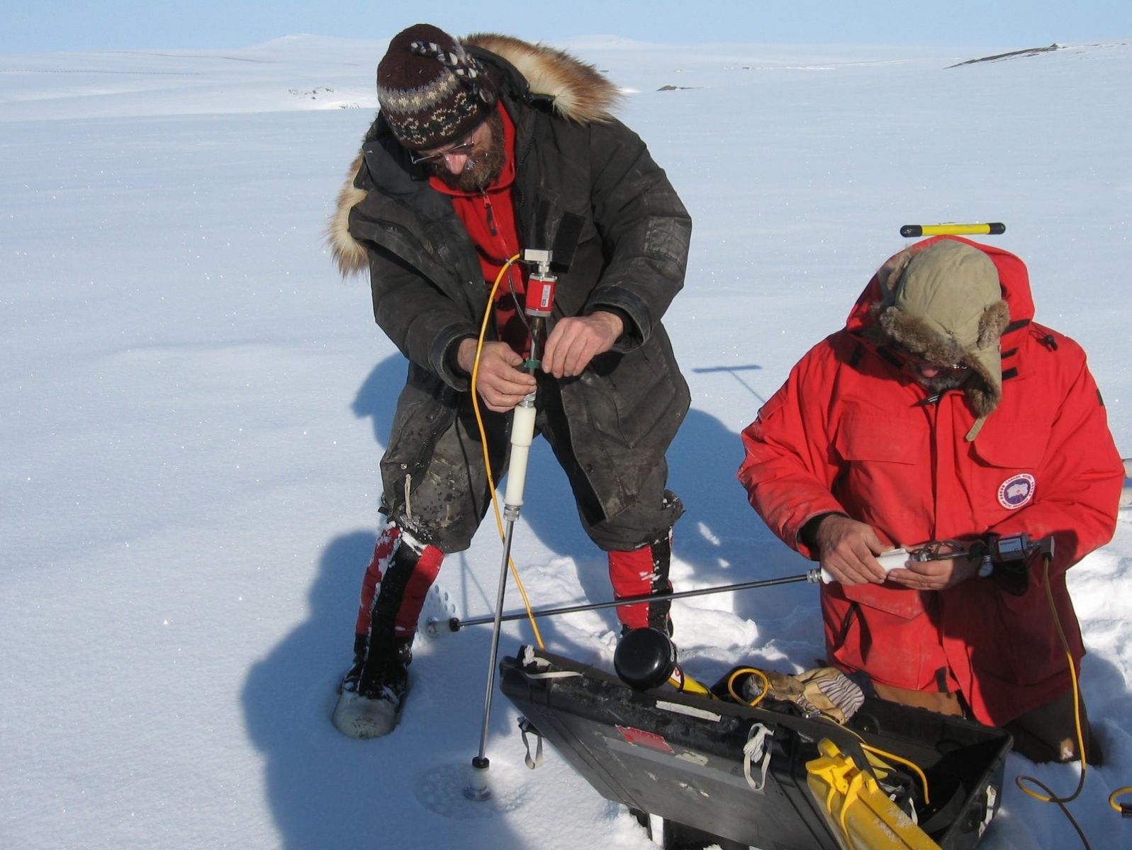 Scientists doing field work in the Arctic