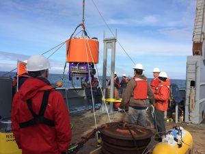 Scientists deploy the environmental sample processor (ESP) off the coast of Washington, to monitor the presence of Pseudo nitzschia and their toxin, domoic acid. Credit: NOAA.