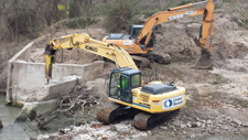 The Southeast Habitat Team removing the concrete barrier