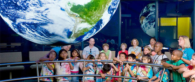 Elementary school students get a demonstration of Science On a Sphere