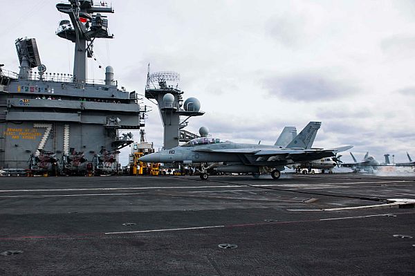 ATLANTIC OCEAN (Jan. 16, 2015) An F/A-18F Super Hornet flown by Capt. Daniel Grieco, commanding officer of the aircraft carrier USS Theodore Roosevelt (CVN 71), and Capt. Benjamin Hewlett, deputy commander of Carrier Air Wing (CVW) 1, completes the 200,000 arrested landing aboard Theodore Roosevelt. Photo courtesy of U.S. Navy.