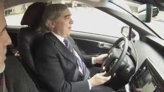 Image of Secretary Moniz test driving the Toyota Mirai.