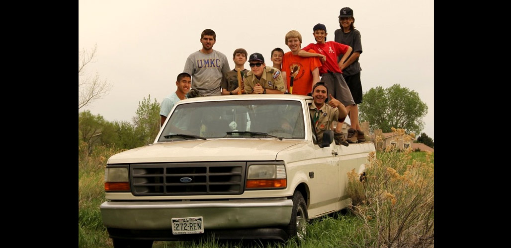 Photograph of Boy Scout volunteers riding in a truck. Photo Credit: Seth Beres / FWS