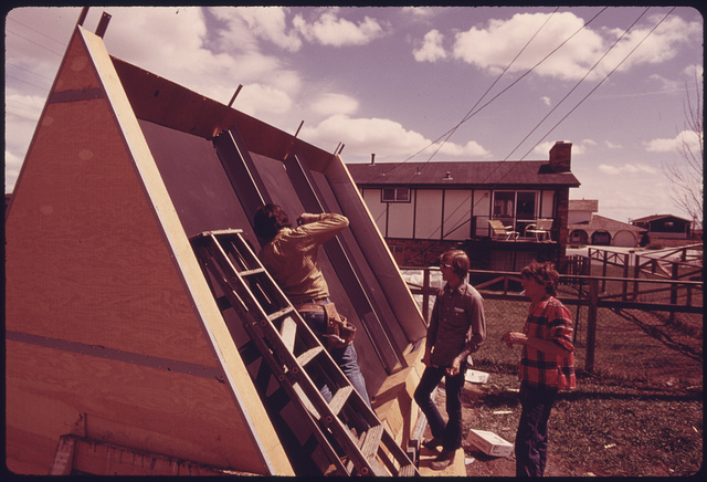 DOCUMERICA: Backyard solar heating system being installed at a home..., 05/1975 by Boyd Norton.