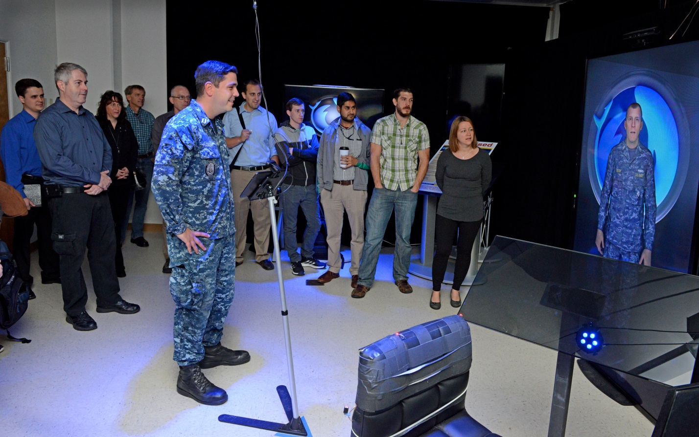 Lt. Dave Nobles interacts with an avatar during a tour of Space and Naval Warfare Systems Center Pacific's (SSC Pacific) Battlespace Exploitation of Mixed Reality laboratory during the "Learn Warfighter Needs" workshop Jan. 28, 2015. The workshop included SSC Pacific scientists and engineers and San Diego-based Sailors and Marines from USS Benfold (DDG 65), 1st Light Armored Reconnaissance Battalion, and Marine Corps Forces Special Operations Command. U.S. Navy photo by Alan Antczak.