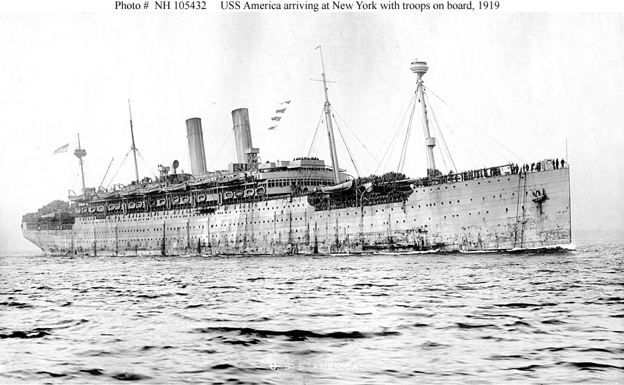 USS America Arriving in New York Harbor, with her decks crowded with troops returning home from France, 1919. Photographed by E. Muller, Jr., New York. Donation of Dr. Mark Kulikowski, 2007. U.S. Navy Photo courtesy of Naval History and Heritage Command