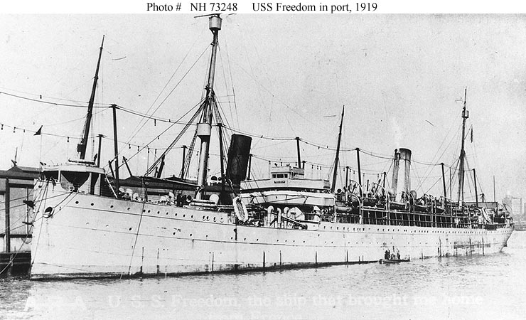 USS Freedom in port in 1919, while engaged in transporting U.S. troops home from France. Note inscription at the bottom of the image: U.S.S. Freedom, the ship that brought me home. U.S. Navy Photo courtesy of Naval History and Heritage Command