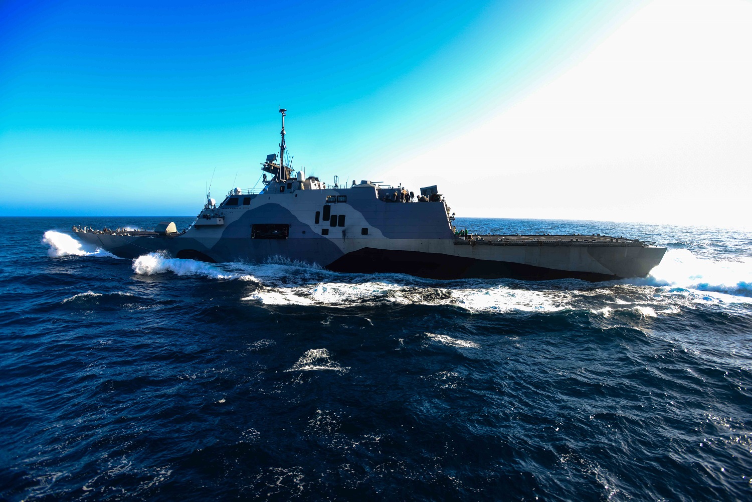 PACIFIC OCEAN (April 27, 2015) The littoral combat ship USS Freedom (LCS 1) transits alongside the aircraft carrier USS John C. Stennis (CVN 74). U.S. Navy ships are underway conducting an independent deployer certification exercise in the Southern California operating area. The exercise provides a multi-ship environment to train and certify independent deployers in surface warfare, air defense, maritime interception operations, command and control/information warfare, command, control, computers and combat systems intelligence and mine warfare. U.S. Navy photo by Mass Communication Specialist Seaman Christopher Frost