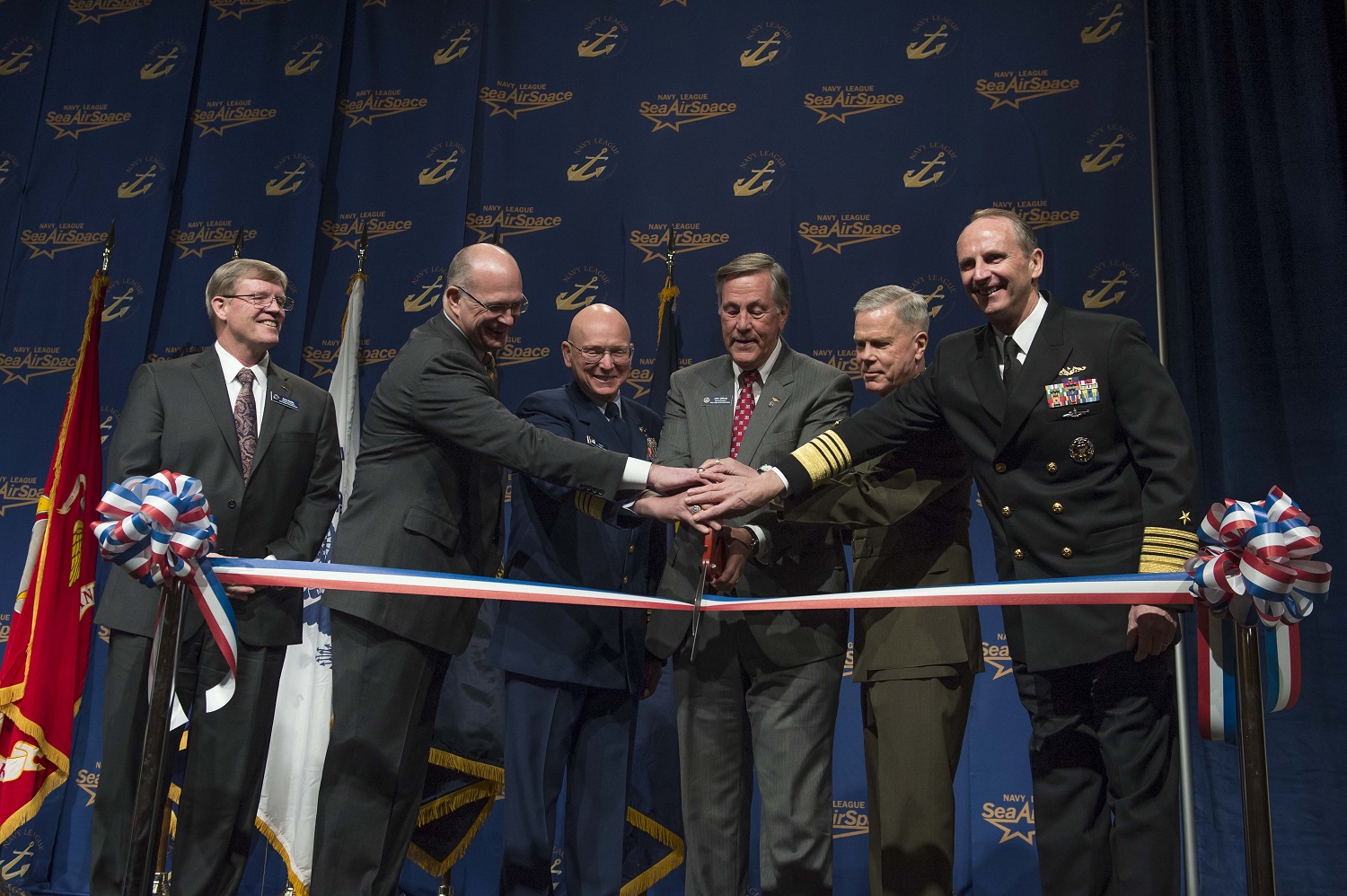 NATIONAL HARBOR, Md. (April 7, 2014) Chief of Naval Operations (CNO) Adm. Jonathan Greenert, right, Commandant of the Marine Corps Gen. James Amos, Jim Offutt, president of the Navy League of the United States, Commandant of the U.S. Coast Guard Adm. Robert Papp and Acting Administrator of the Maritime Administration Paul "Chip" Jaenichen cut a ribbon to open the Navy League Sea-Air-Space Exposition. U.S. Navy photo by Chief Mass Communication Specialist Peter D. Lawlor.