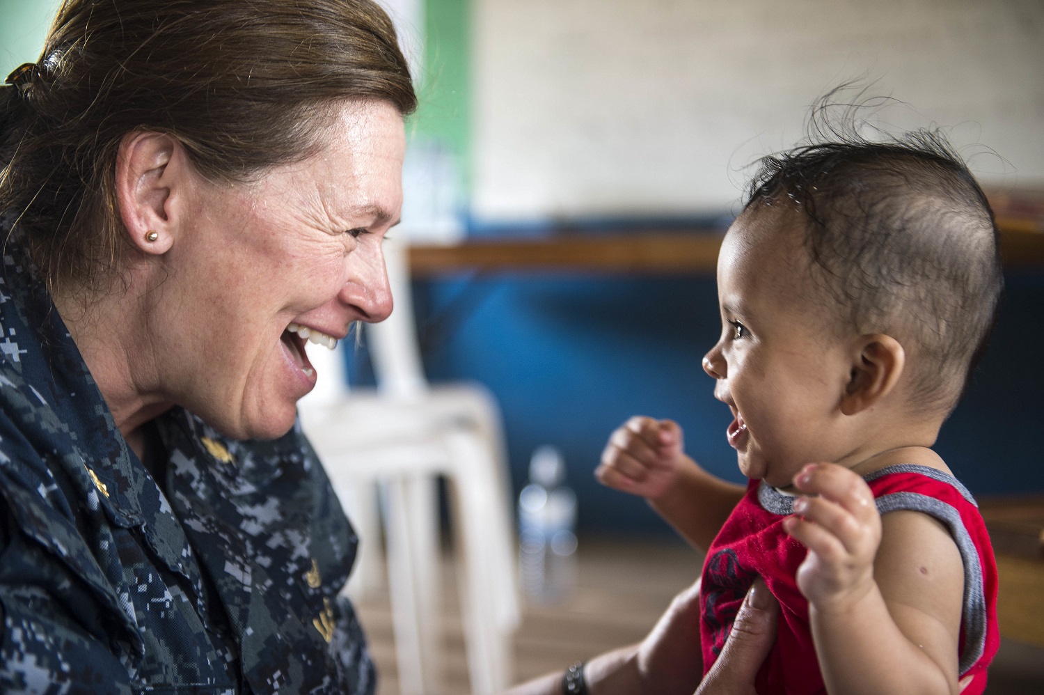 U.S. Navy Lt. Cmdr. Carrie Dreyer, a physical therapist, interacts with a baby in Puerto Cabezas, Nicaragua, during a Continuing Promise 2015 medical event, May 24, 2015. Continuing Promise is a U.S. Southern Command-sponsored deployment to conduct civil-military operations and show U.S. support and commitment to Central and South America and the Caribbean. Dreyer is assigned to Walter Reed National Military Medical Center in Bethesda, Md. U.S. Navy photo by Petty Officer 3rd Class Andrew Schneider 