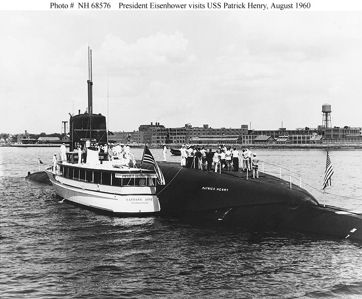 USS Patrick Henry (SSBN-599), with President Dwight D. Eisenhower and his party on board, August 1960. The Presidential boat Barbara Anne is alongside. U.S. Navy photo courtesy of NHHC.