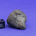 Chelyabinsk meteor fragment shown next to a 1-cm scale cube.