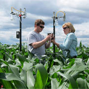 Photo of LIDE scientists collecting an air sample for pathogen testing