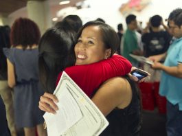 Salve Reed hugging friend (© AP Images)