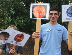 Young participants holding signs at Catawba Science Center