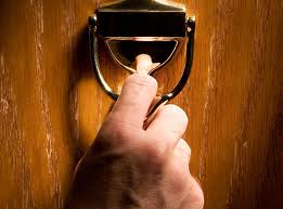 hand on door knocker