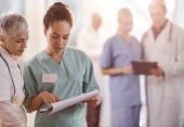 A photo of doctors discussing a document