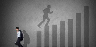 Illustration of one person climbing up bar graph and another walking away disappointedly (Shutterstock)