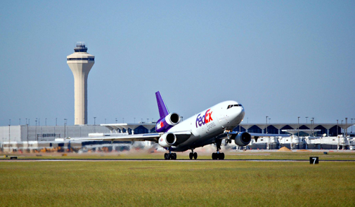 Photo of a pane taking off from a runway at Memphis International Airport