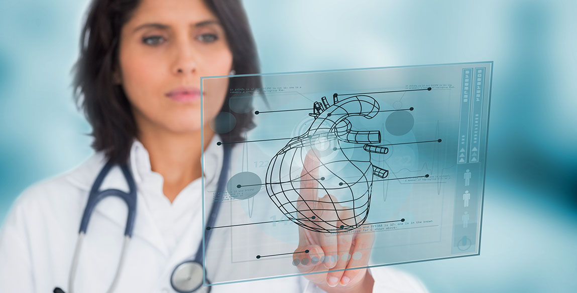 A woman in a doctor's scrubs and coat tapping on an electronic panel.