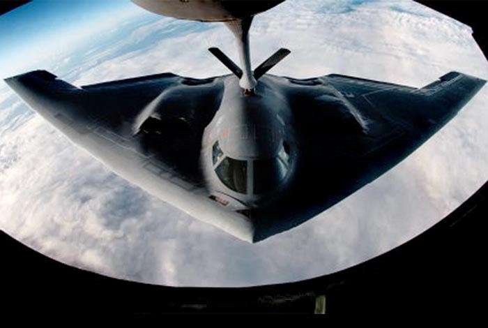 A B-2 Spirit bomber refuels from a KC-135 Stratotanker