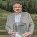 Dipen Sinha displays the innovative technology award presented by the Feynman Center for Innovation.