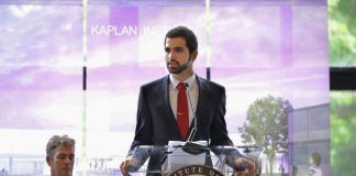 Man standing at lectern (Courtesy of Hamze “Leo” Sukkar)