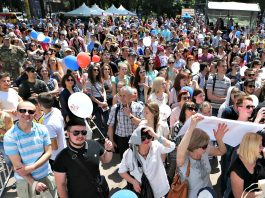 Crowd of people standing outside and listening (U.S. Embassy Kyiv)