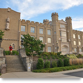 Photograph of the front façade of Hinckle Hall, a 3-story Tudor-Gothic academic building.